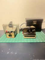 Front view of both cameras with case