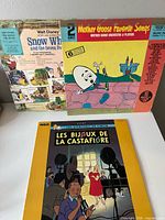 Front sleeves of all three vinyl records