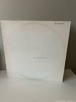 Front of gatefold sleeve showing embossed title and wear