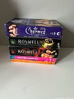 Stacked view of five DVD season sets showing spines and titles
