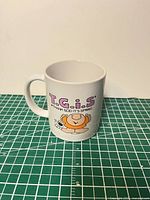 Front view showing graphic and text on mug