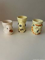Front view of all three ceramic animal egg cups