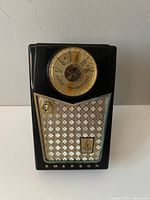 Front view of Emerson transistor radio showing dial, grille and branding