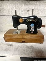 Front angled view showing Holly Hobbie decal, needle area and brown base