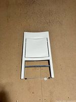 chair folded flat showing entire front