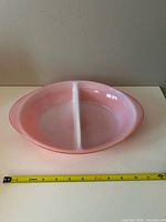 Top view showing divided pink and white interior with measuring tape indicating length