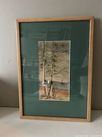 Full view of framed painting on wall