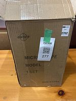 Closed cardboard box labeled Swift Microscope Model 1 Set, Made in China, with MaxSold sticker.