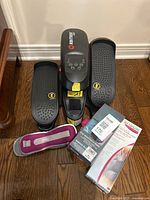 Front view of Britrex MX elliptical pedals and control, plus wristbands, resistance band box, knee stabilizer brace