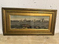 Full view of the framed silk textile artwork showcasing a detailed cityscape with water, buildings, and ships.