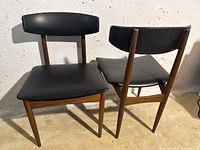 Two chairs upright showing front seat and backrest