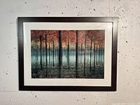 Front view of the framed digital photograph showing the forest scene with red foliage and misty background.