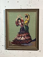 Full view of framed tapestry showing flamenco dancers in traditional Spanish dress.
