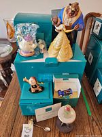 Main shot showing all five ceramic Beauty and the Beast figurines with original boxes and certificates