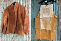 Brown leather welder’s jacket hanging on a hanger showing front view and two-tone suede leather work apron back view with original tag.