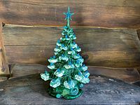 Front view of full ceramic tree on wooden backdrop