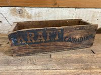 Side view of vintage wooden Kraft Canadian cheese box showing clear 'KRAFT' branding, weight, and company information in black stenciling.