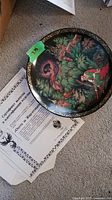Collector plate showing Russian folklore artwork with characters in vibrant colors and certification paper