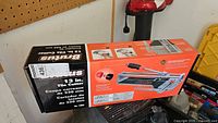 Box for Brutus 13 inch tile cutter showing brand and model number