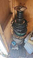 Stack of multiple spools in shed corner