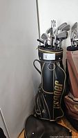 Side view of golf bag with clubs inside, Cooper brand visible