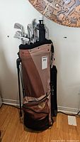 Full view of TaylorMade golf bag holding Spalding golf clubs