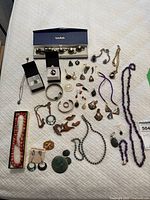 All items spread out on a white quilted surface