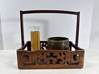 Overall view of hardwood stand containing bronze vessel, bamboo holder and glass insert