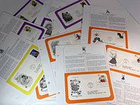 Scatter of nine album pages showing various FDCs with character stamps