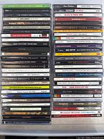 Full stacked view of all 38 CDs showing spines