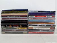Full view of two vertical stacks showing all 22 CD spines