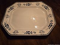 Photo of Adams Gloucester rectangular platter with blue floral edging on white ceramic surface