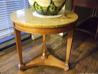 Photo of round Italian Provincial revival style lamp table in fruitwood with tapered legs, stretcher, and refinished top surface.