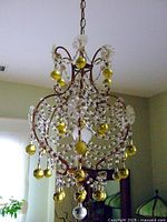 Overall front view showing basket-shaped frame, bead swags and drop pendants