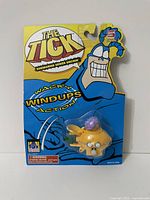 Front view of original packaging showing The Tick branding and the submarine sewer urchin toy inside blister pack.