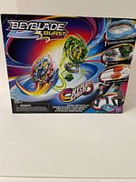 Front of Beyblade Burst Rise battle set box showing Beyblade tops and battle stadium graphics.