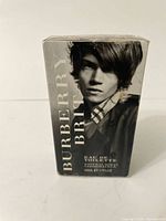 Front view of the sealed box showing branding and product details.