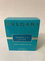 Front view of the turquoise blue Bvlgari Omnia Paraiba perfume box showing branding and collection details.