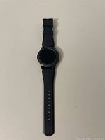 Samsung Gear S3 Frontier smartwatch front view showing black digital screen and textured rubber strap.