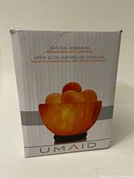 Box front showing illustration of the Umaid Natural Himalayan Massage Balls with Lamp Bowl set