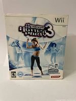 Front view of Wii Dance Dance Revolution Hottest Party 3 game box with visible damage.