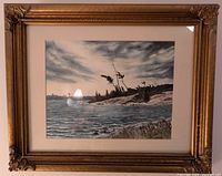 Framed original watercolour painting showing rocky shoreline with trees and cloudy sky, signed by artist George Dunn.