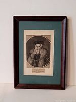 Framed etching showing full artwork and frame