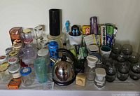 Full display of kitchen items including Cuisinart kettle, mason jars, food wraps, and glasses