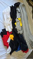 Stack of assorted blank t-shirts in multiple colors