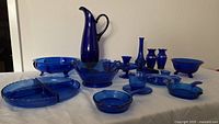 Overview of entire cobalt blue glass collection on table