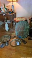 Full lot overview showing table, trays, wall hanging, and lamp