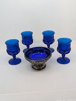 Full set showing the EPNS silver plated bowl with cobalt blue glass insert and four cobalt blue glasses.