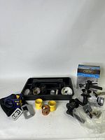 Full view of the three door handle sets, various holesaws in a black tray, and Irwin drilling template tool on the side.