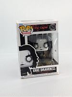 Front view of unopened Funko Pop! figure in box with slight corner bends, showing Eric Draven from The Crow #1429 inside clear plastic window.